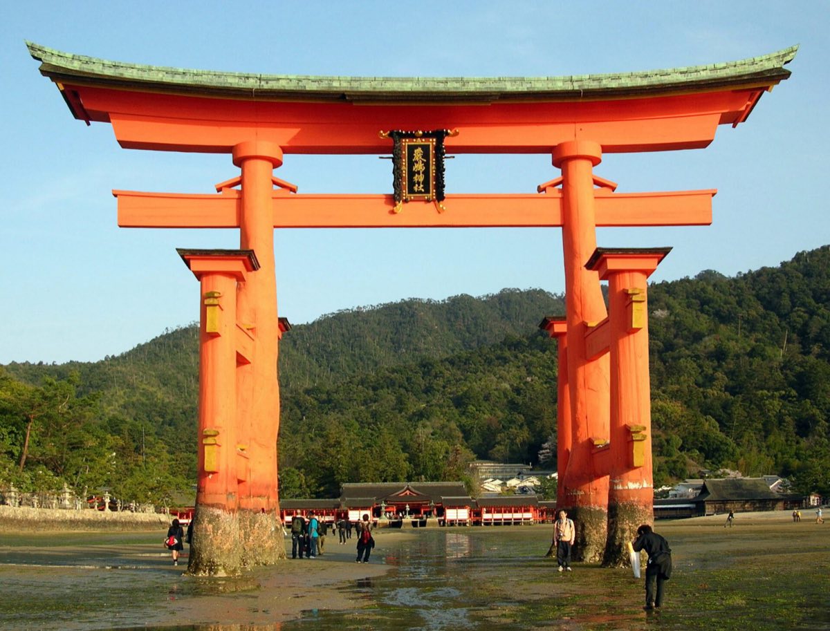 The Great Torii and the shrine buildings of Itsukushima standing over water at high tide